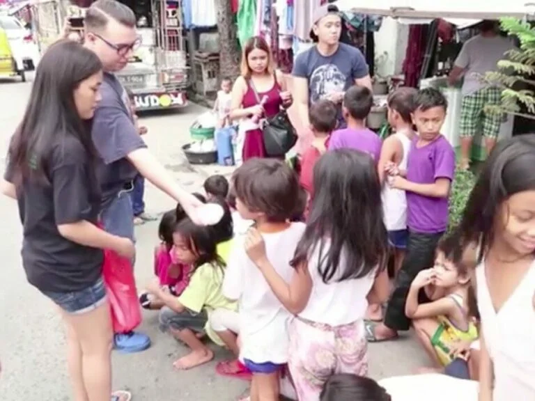 Joseph doing charity work with children in Manila